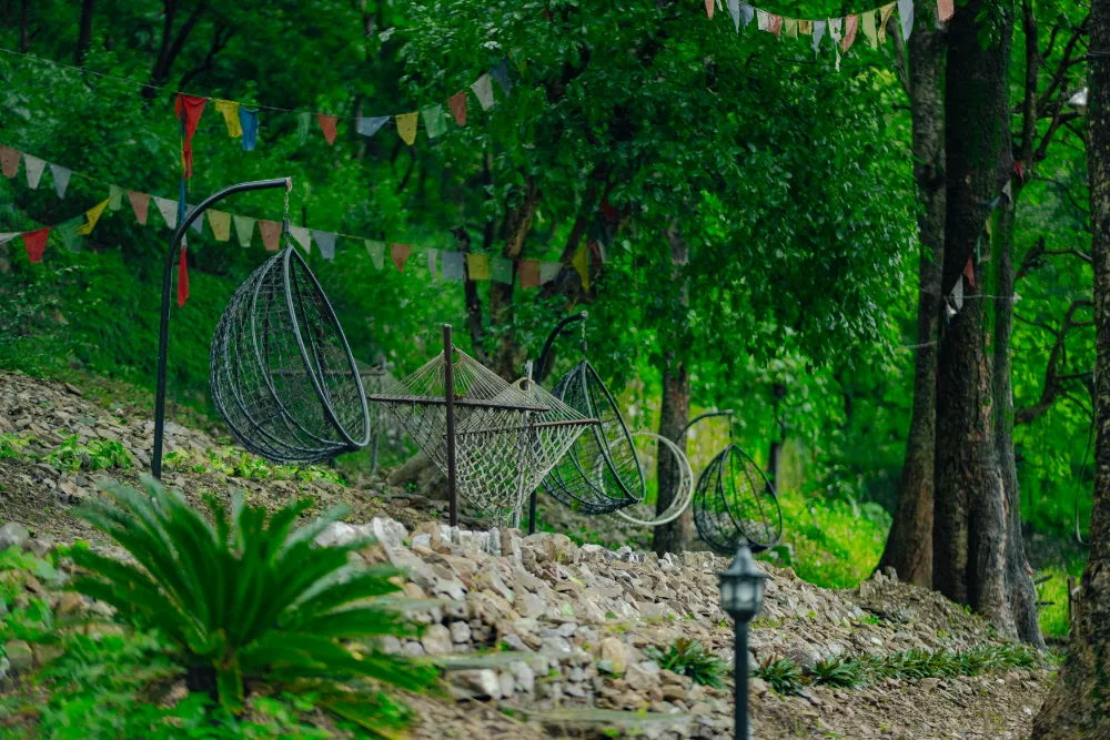 Hammocks resting in the shaded gardens of the ashram