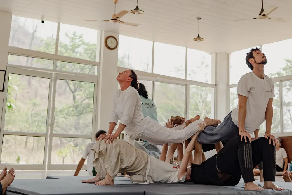 Two practitioners working together in a supported stretch