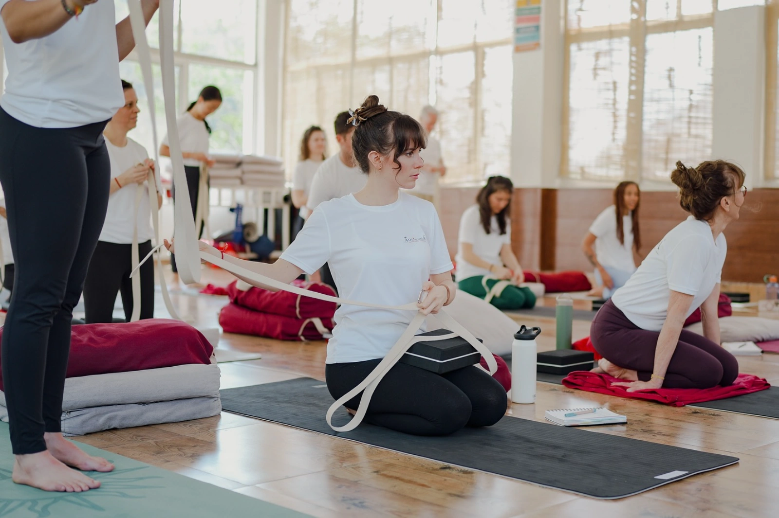 Students of the 200 hour yoga teacher training practising together in the Adhiroha shala
