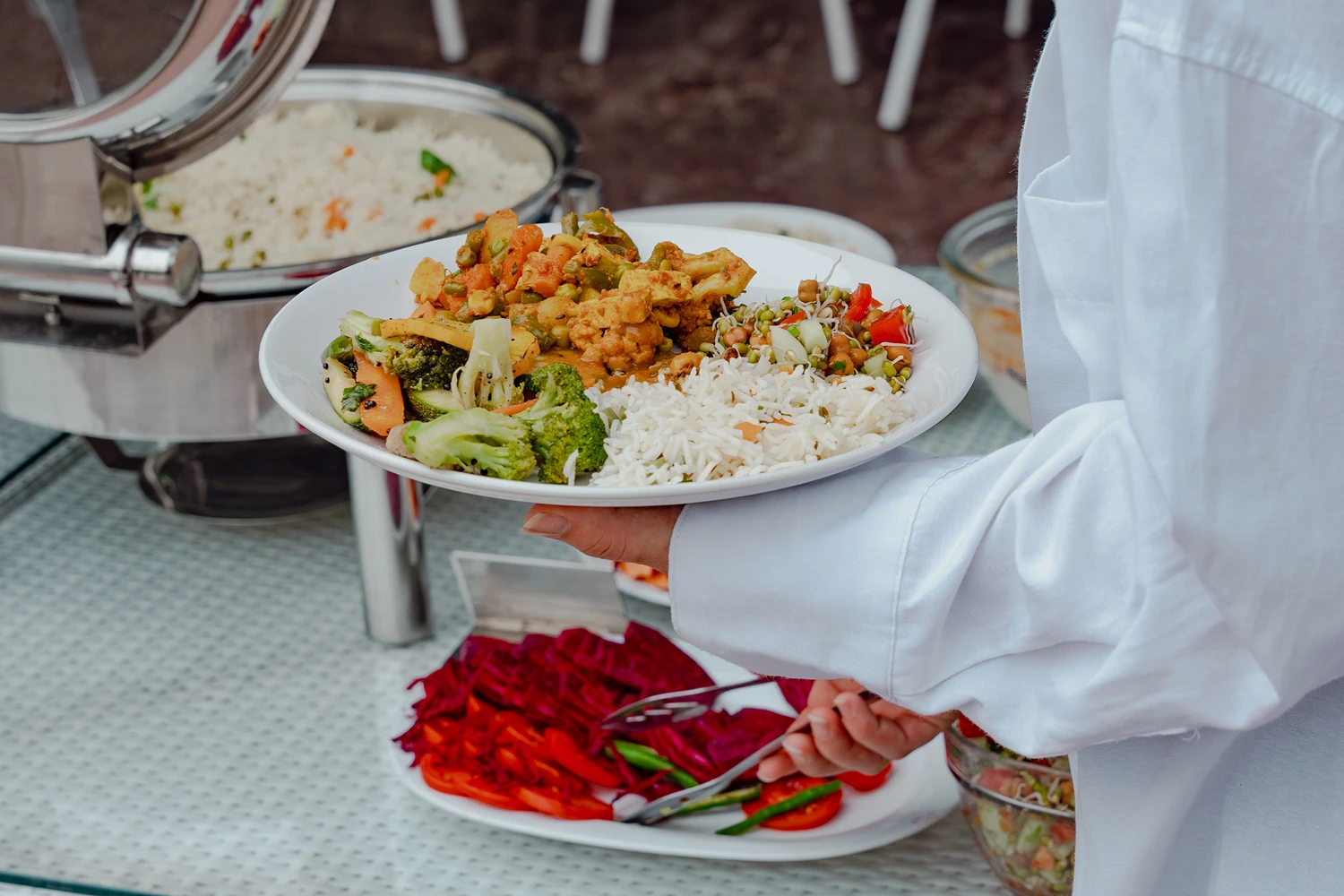 A student serving a fresh Satvik meal from the buffet