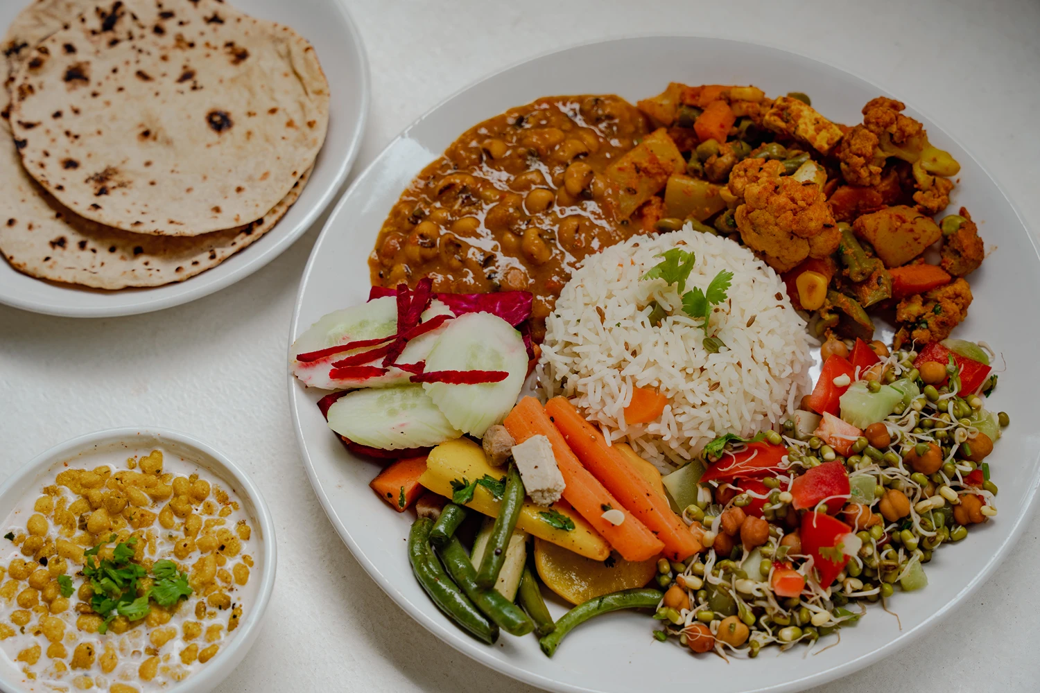 A wholesome plate from the Adhiroha kitchen &mdash; rice, curry and fresh salad