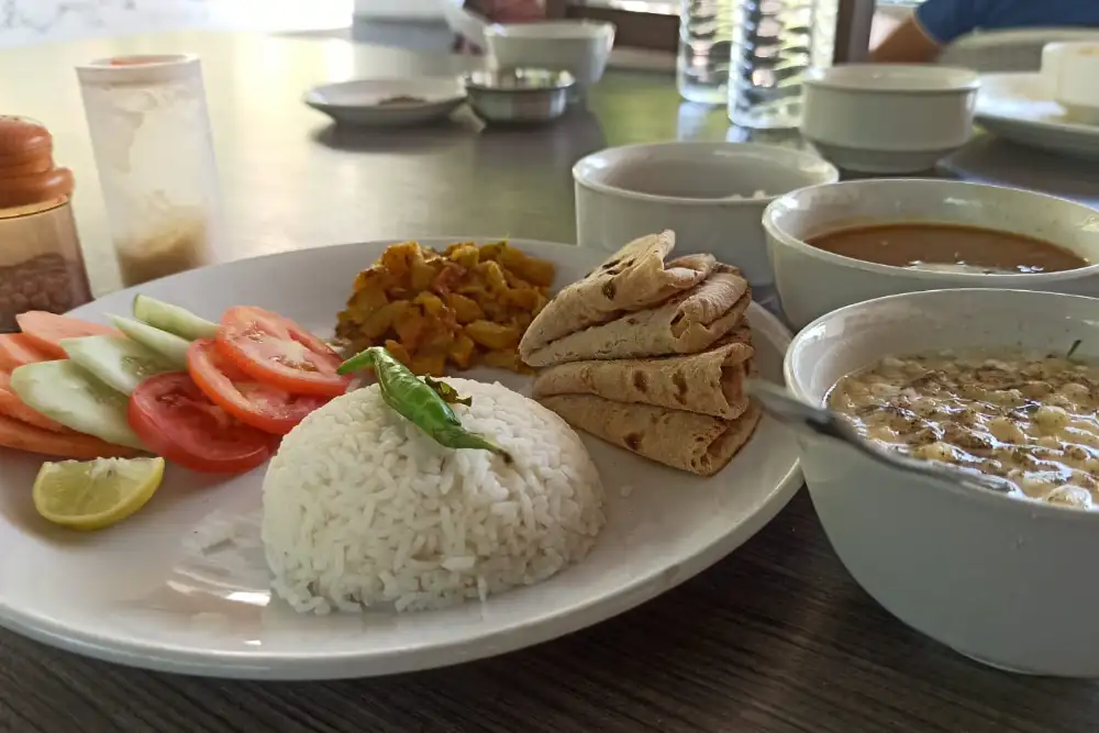 A fresh Satvik thali — rice, dal, vegetables and salad