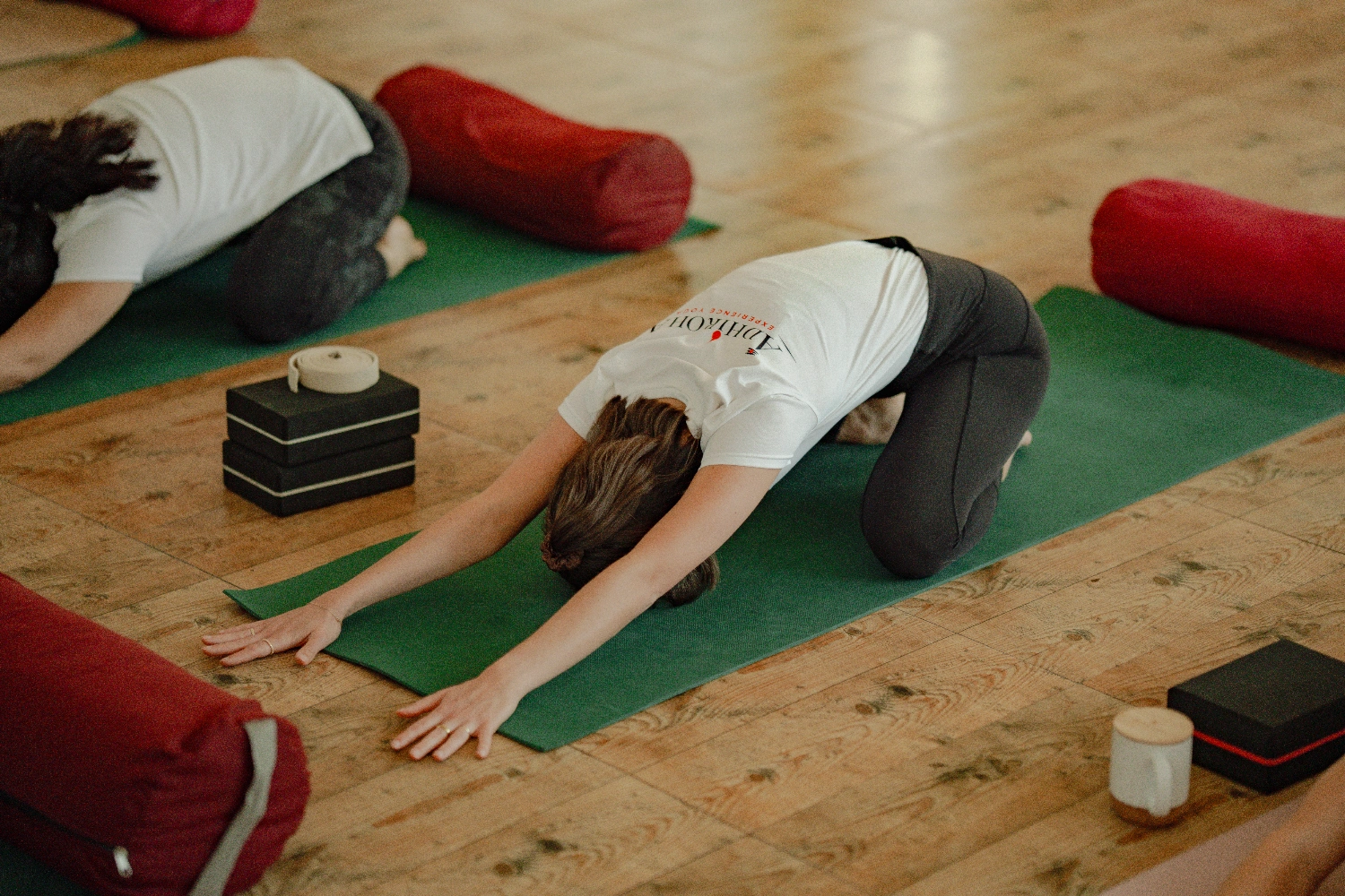 A student resting gently between postures during the training