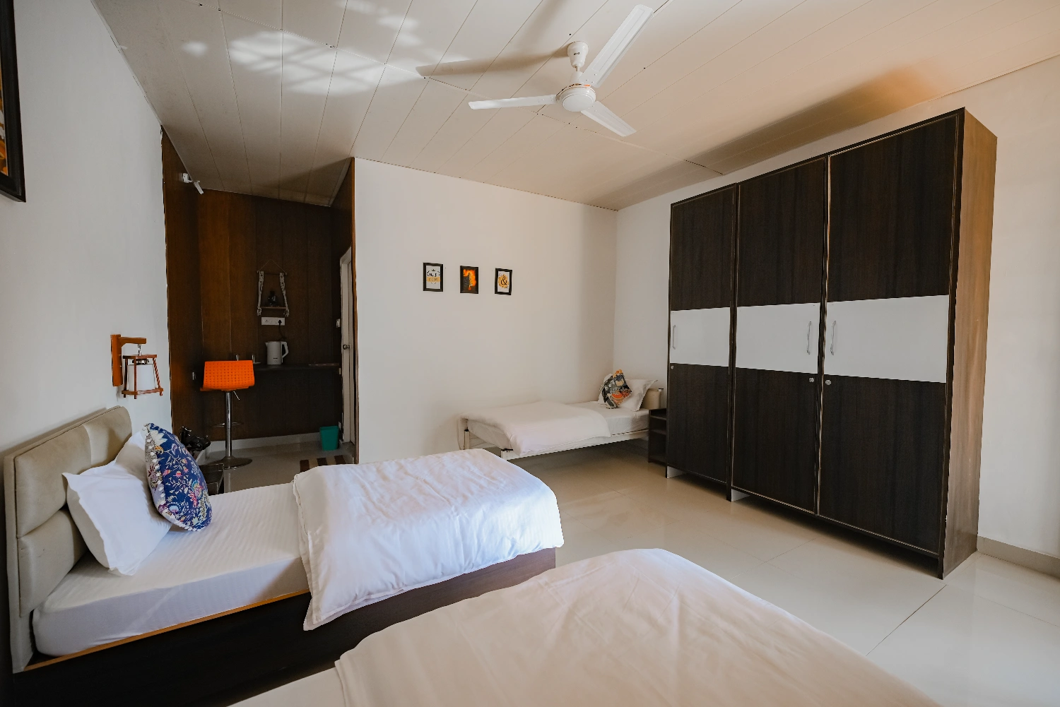 A clean, spacious room at Adhiroha with mountain views