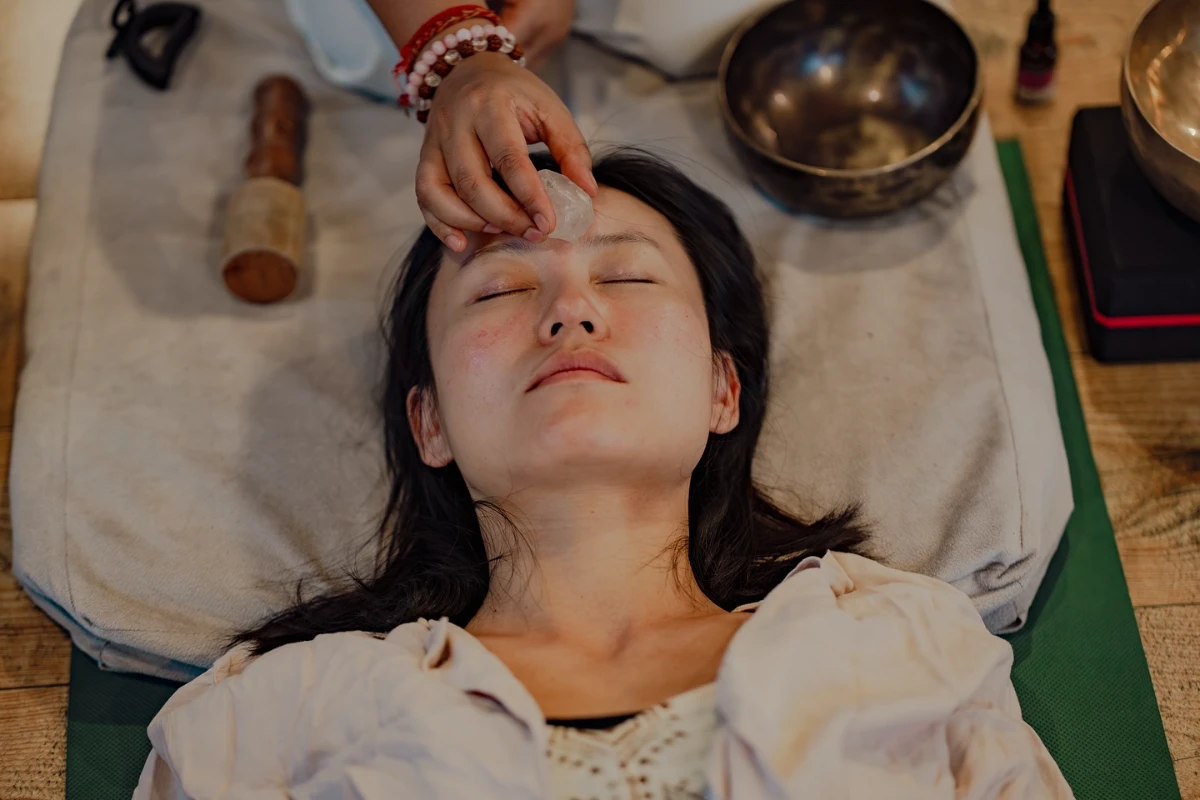 A singing bowl placed on a student&rsquo;s head to clear and focus the mind