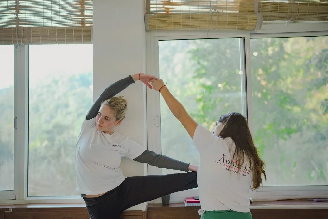Two practitioners working together in a supported stretch