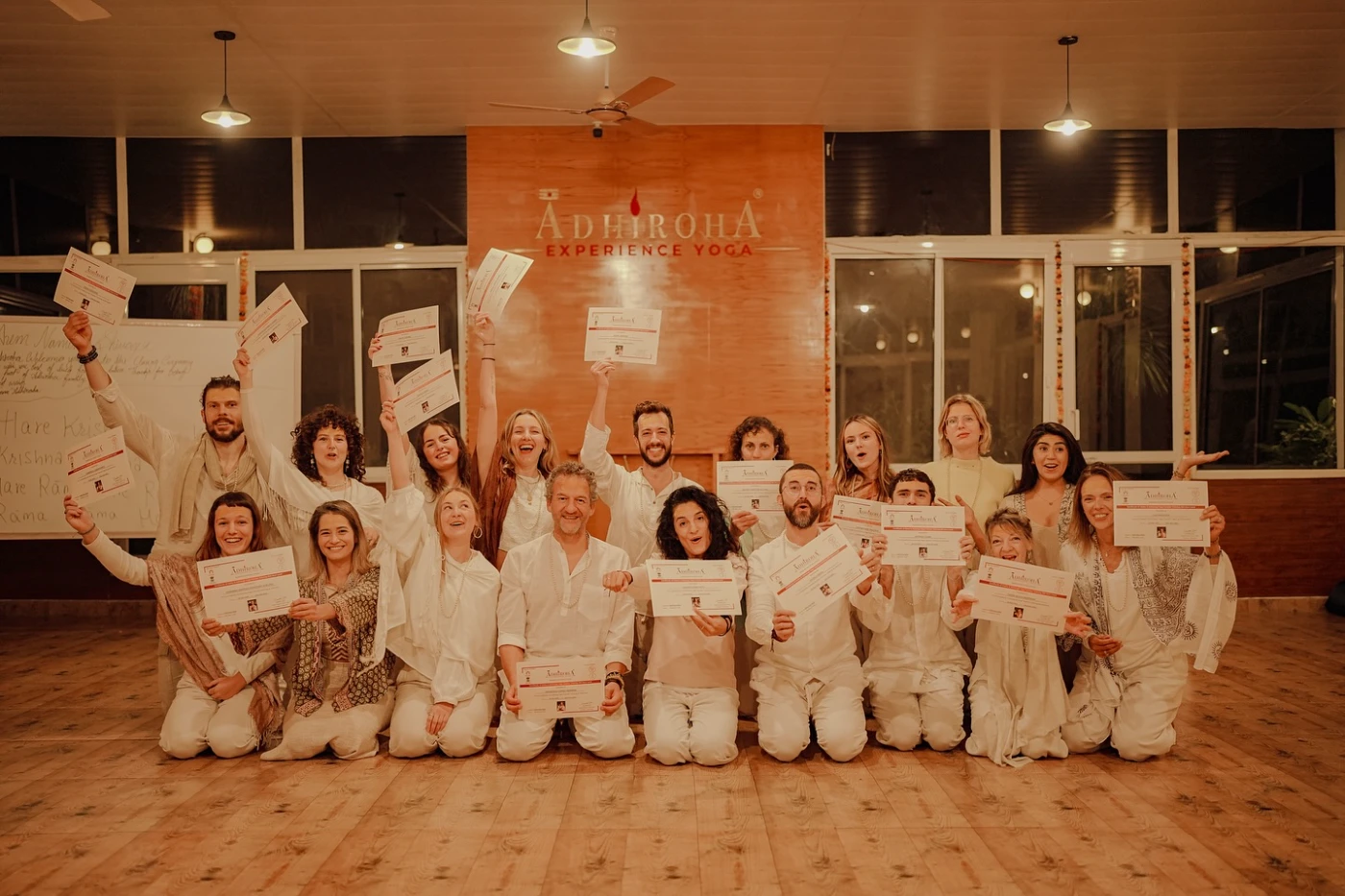 An Adhiroha graduate receiving an internationally recognised yoga certification