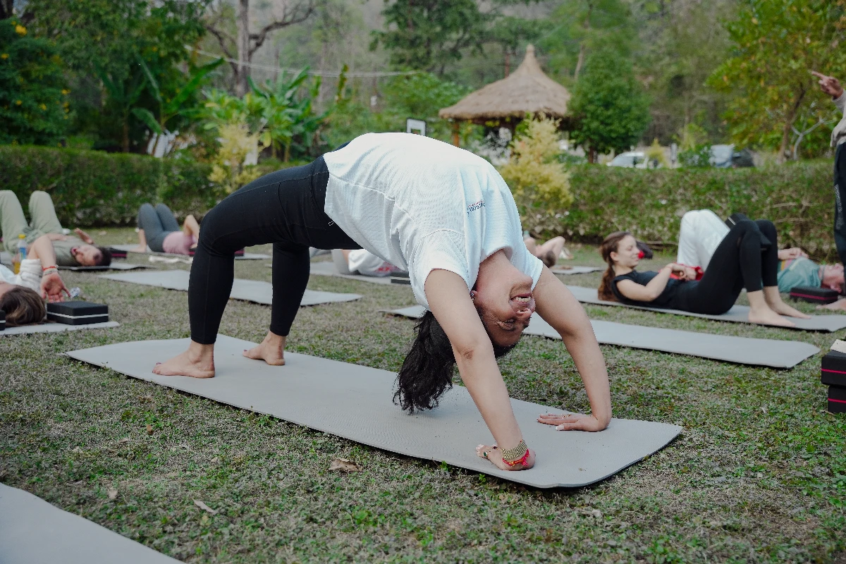 woman practicing gentle evening yoga before bed